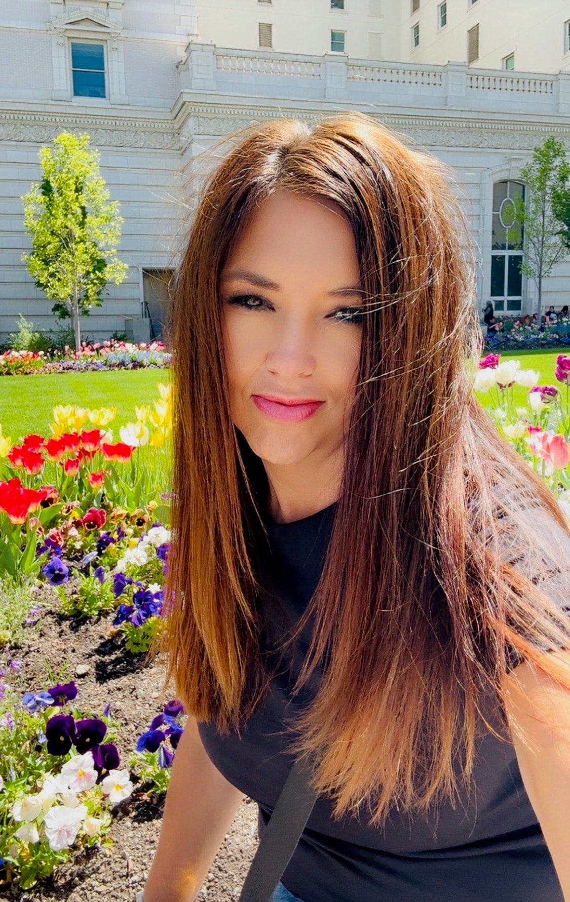 Deanna Farmer among spring flowers